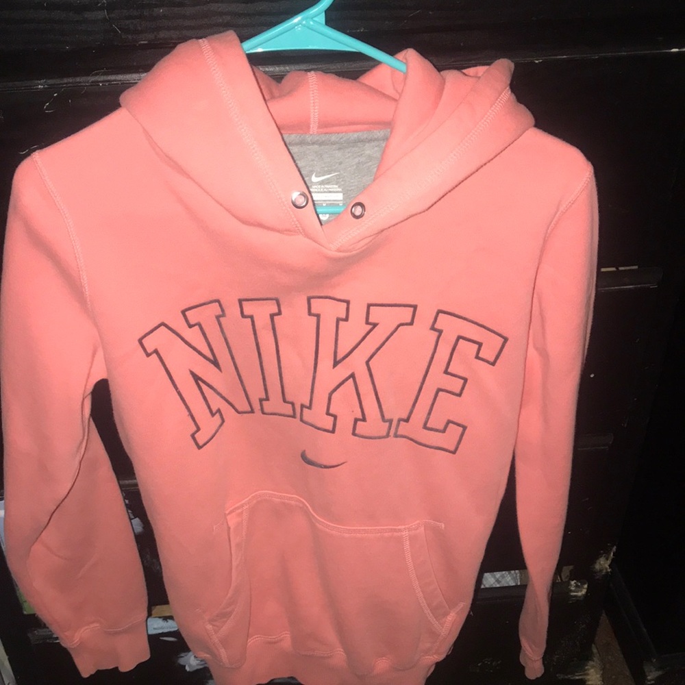 Coral pink nike sweater with a hoodie